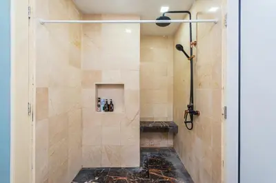 a walk in shower with a glass door at Fahrenheit 88 Kuala Lumpur in Kuala Lumpur