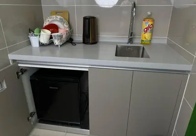 a kitchen counter with a sink and a microwave at KLCC view cozy studio apartment Trion C243A KL in Kuala Lumpur