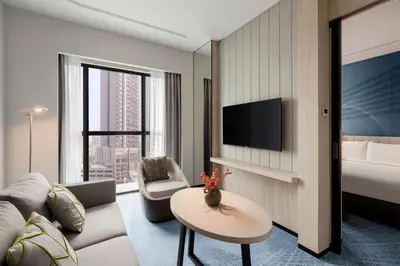 a living room with a couch and a table at Holiday Inn Kuala Lumpur Bangsar by IHG in Kuala Lumpur