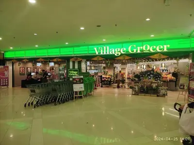 a village grocery store with a green sign in a mall at KL Dorsett Damas Grandeur Suite-F-Parking, Self C-In in Kuala Lumpur