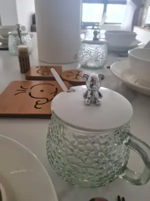a glass mug with a teddy bear on top of it at KL View 3BedRoom 2carpark MRT Station Cheras Maluri FreeWifi C41 in Kuala Lumpur