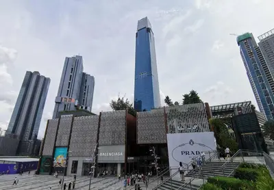 a group of people walking in a city with a tall building at Bintang Fairlane Residence, Cozy Fam Suite with Bathtub - 2B2R in Kuala Lumpur