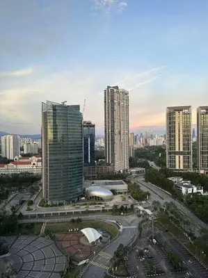 a city with tall buildings and a street with cars at Arte Mont Kiara in Kuala Lumpur
