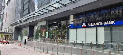 a large glass building with aamine bank sign on it at Star Superior KLCC Suite 4-5pax by LavishHome in Kuala Lumpur