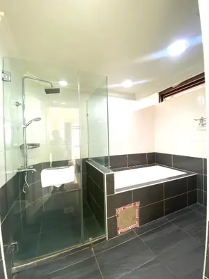 a bathroom with a glass shower and a sink at Unique Suite Times Square at Bukit Bintang Kuala Lumpur in Kuala Lumpur