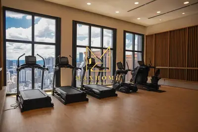 a gym with treadmills and exercise equipment in a building at Maxhome Retreat at Lucentia in Kuala Lumpur