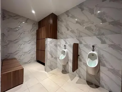 a bathroom with two urinals on the wall at The Little Series - Bukit Bintang - TRX View - 4 Pax in Kuala Lumpur