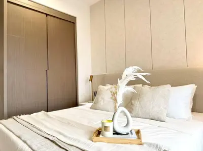 a bed with a tray with a mirror on it at The Little Series - Bukit Bintang - TRX View - 4 Pax in Kuala Lumpur