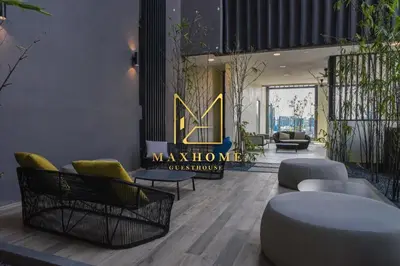 a lobby with couches and chairs and a sign that says maximize at Maxhome Elite at Lucentia in Kuala Lumpur