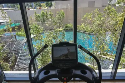 a camera in front of a window with a swimming pool at Maxhome Elite at Lucentia in Kuala Lumpur
