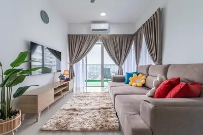 a living room with a couch and a large window at 5min to KL TRX Bukit Bintang for 6paxs in Kuala Lumpur