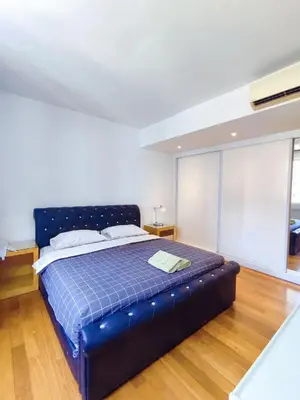 a bedroom with a blue bed in a room at Comfy Stay at Wisma Cosway Pavilion KLCC Bukit Bintang in Kuala Lumpur