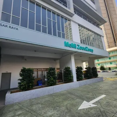 a large building with a sign on the front of it at M 2-7pax 200mbpswifi near Mrt Lrt HKL IJN in Kuala Lumpur