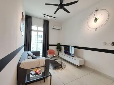 a living room with a couch and a ceiling fan at M 2-7pax 200mbpswifi near Mrt Lrt HKL IJN in Kuala Lumpur