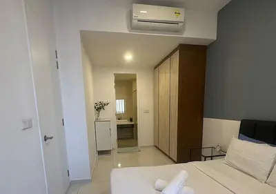a hotel room with a bed and a bathroom at robertson by katie suites in Kuala Lumpur
