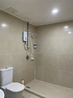 a bathroom with a shower and a toilet in it at Parkview Service Apartment By Bonjour in Kuala Lumpur