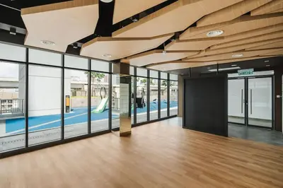 an empty office with glass doors and wooden ceilings at Lemon Loft 2BR opposite MyTown near TRX by RumaBnB in Kuala Lumpur