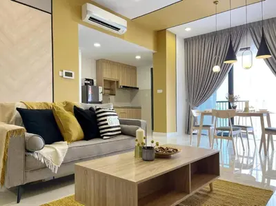 a living room with a couch and a table at Lemon Loft 2BR opposite MyTown near TRX by RumaBnB in Kuala Lumpur