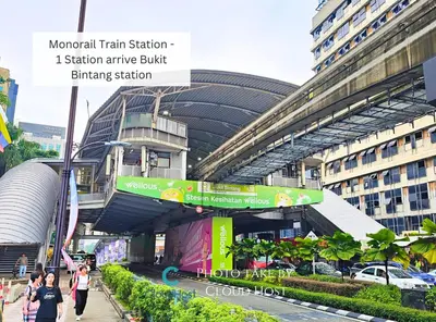 a train station with people walking in front of a building at St Mary KLCC Luxury 3BR High End Residence 7min Walk to Pavilion and Bukit Bintang by Cloud Host in Kuala Lumpur