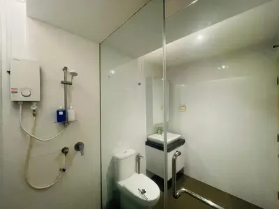 a bathroom with a shower and a toilet and a sink at EST Bangsar KL Sentral by DeUrban in Kuala Lumpur