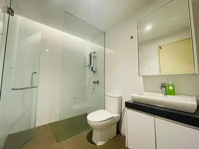 a white bathroom with a toilet and a sink at EST Bangsar KL Sentral by DeUrban in Kuala Lumpur