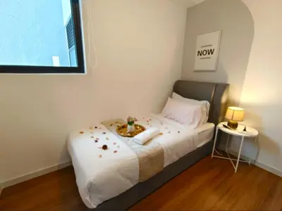 a small bedroom with a bed with flowers on it at M-Vertica Sunway Velocity Cheras by Luvit Stay in Kuala Lumpur