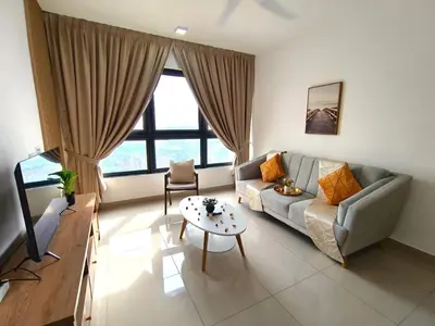 a living room with a couch and a table at M-Vertica Sunway Velocity Cheras by Luvit Stay in Kuala Lumpur
