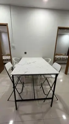 a white table and chairs in a white room at City Centre KLCC in Kuala Lumpur