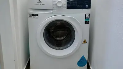 a white washing machine sitting next to a wall at Sentral 108 Home Brickfields Bangsar Kuala Lumpur 2-5Pax in Kuala Lumpur