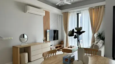 a living room with a table and a dining room at Sentral 108 Home Brickfields Bangsar Kuala Lumpur 2-5Pax in Kuala Lumpur