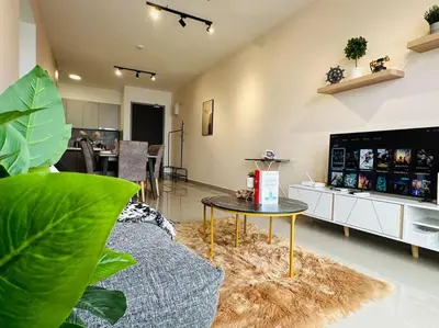 a living room with a couch and a table at MVC50#Family Suite 9pax 3 Rooms M Vertica Velocity Mall Cheras in Kuala Lumpur
