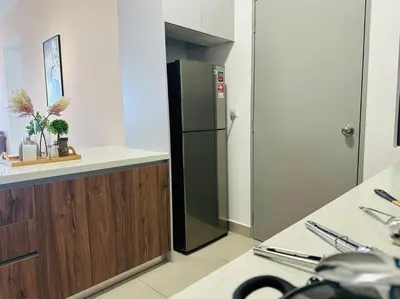 a kitchen with a black refrigerator in a room at MVC50#Family Suite 9pax 3 Rooms M Vertica Velocity Mall Cheras in Kuala Lumpur