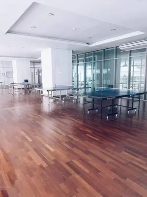 a room with ping pong tables on a wooden floor at PROMO 2 ROOM Nice Design KL Gateway Residence 27 in Kuala Lumpur