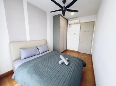 a bedroom with a large bed with a ceiling fan at PROMO 2 ROOM Nice Design KL Gateway Residence 27 in Kuala Lumpur
