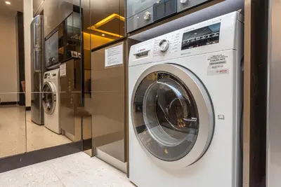 a washing machine and a dryer in a store at Dorsett 1 min to TRX Pavilion 127 in Kuala Lumpur