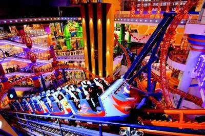 a carnival ride with people on a roller coaster at Kingston Hotel 4 - Hulo Bukit Bintang in Kuala Lumpur