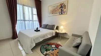 a bedroom with a bed and a couch and a window at Classic couple suite-Netflix-Free-Park Trion B6205St KL in Kuala Lumpur