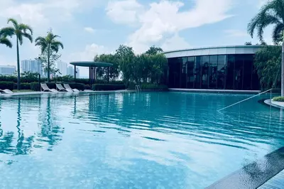 a large swimming pool in front of a building at Classic couple suite-Netflix-Free-Park Trion B6205St KL in Kuala Lumpur