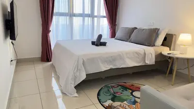 a bedroom with a bed and a table at Classic couple suite-Netflix-Free-Park Trion B6205St KL in Kuala Lumpur