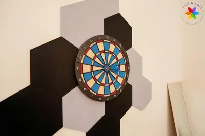 a dart board on a wall with a dartboard at 30P White House Retreat - Pool & Event Hall in Kuala Lumpur