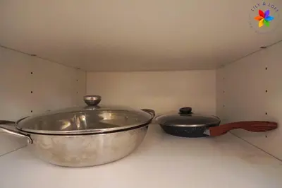 two pots and pans sitting on top of a counter at 30P White House Retreat - Pool & Event Hall in Kuala Lumpur