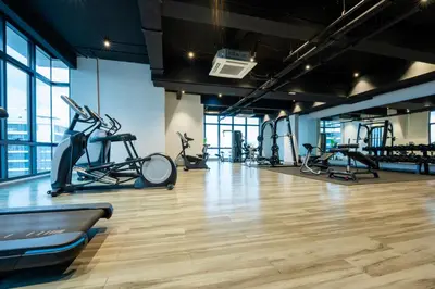 a gym with treadmills and elliptical machines at Moonway Luxury Suites At TM KLCC City Center in Kuala Lumpur