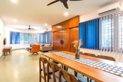 a dining room with a table and chairs at The Heritage Mid Valley l KL Sentral l 8 Pax in Kuala Lumpur