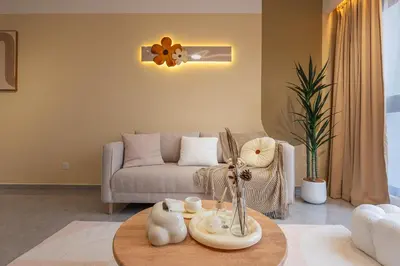 a living room with a couch and a table at Agile Bukit Bintang FaceHome, TRX, Pavilion, KL in Kuala Lumpur
