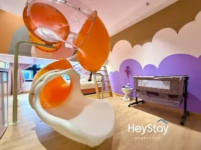 a room with a room with a chair and a bed at Agile Residence Bukit Bintang By Heystay Management in Kuala Lumpur