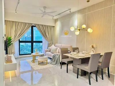 a living room with a dining room table and chairs at Agile Residence Bukit Bintang By Heystay Management in Kuala Lumpur