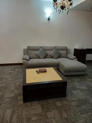 a living room with a couch and a coffee table at Kuala Lumpur Grand service suite at Times Square in Kuala Lumpur