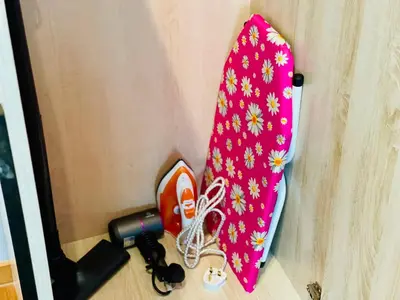 a pink umbrella and a flashlight in a door at Reizz Residence Ampang by DeUrban in Kuala Lumpur