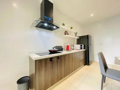 a kitchen with a sink and a stove at Reizz Residence Ampang by DeUrban in Kuala Lumpur