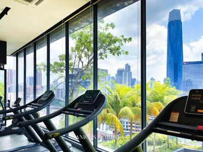 a gym with a view of the city at Continew Residence by Janice's Homestay in Kuala Lumpur